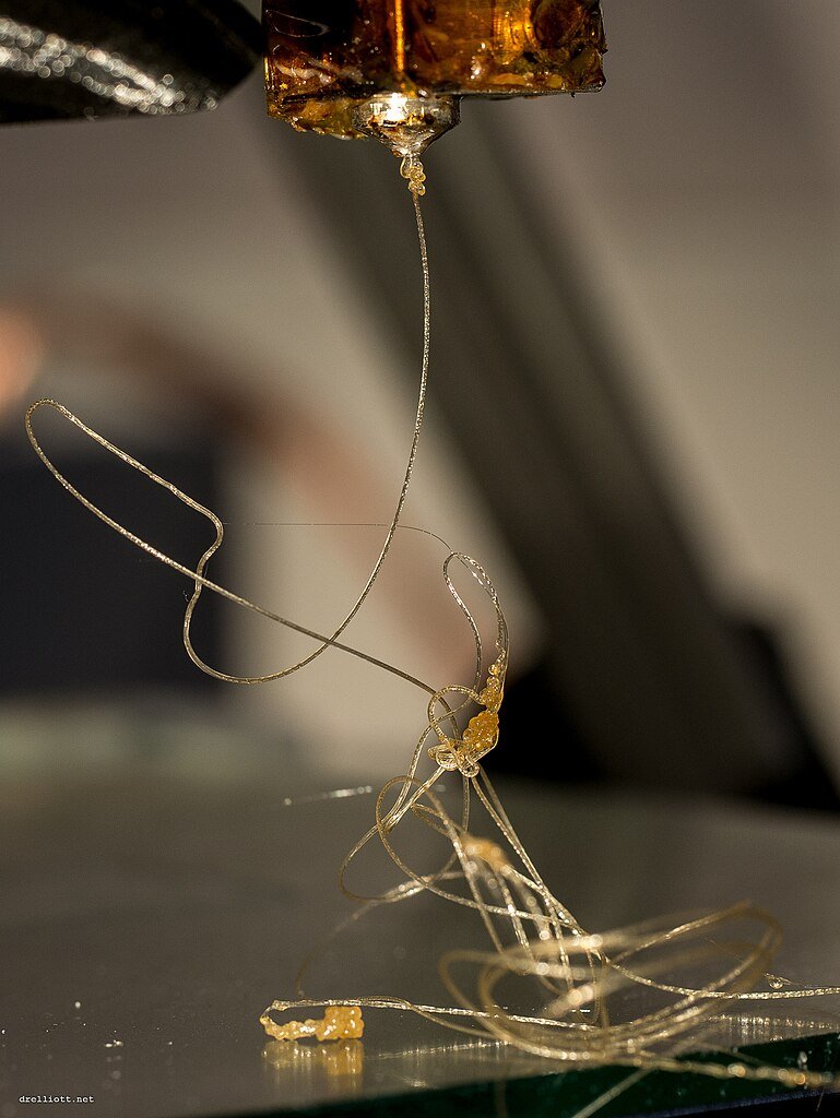 3D printer nozzle extruding plastic